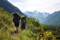 Man with backpack hiking in mountains Travel Lifestyle success concept adventure active vacations outdoor mountaineering sport Royalty Free Stock Photo