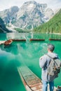 man with backpack looking at fabulous view of mountain lake Royalty Free Stock Photo
