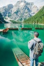 man with backpack looking at fabulous view of mountain lake Royalty Free Stock Photo
