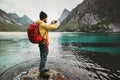 Man with backpack taking photo by smartphone Royalty Free Stock Photo