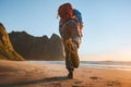 Man with backpack trail running on beach adventure travel vacations active healthy lifestyle outdoor