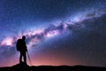 Man with backpack and trekking poles and Milky Way Royalty Free Stock Photo