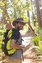 Man with backpack walking on the path in forest Royalty Free Stock Photo