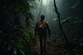 Man with backpack walking on the trail in the jungle at night, Male Hiker walking through a dense dark jungle, rear view, full
