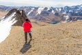 Man backpacker mountaineer standing mountain snow ridge peak, Bolivia