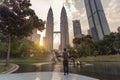 A man backpacker is traveling and sightseeing Landmark twin tower of Kuala Lumpur