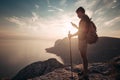 Man backpacker using smartphone relaxing on mountain Royalty Free Stock Photo