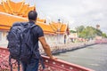 Man backpacker visiting Asia during a sunny day , Solo trip and vacations concept .