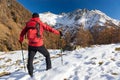 Man is backpacking in winter mountains. Piemonte, Italian Alps, Royalty Free Stock Photo