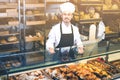 Man baker showing warm tasty croissant Royalty Free Stock Photo