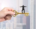 Man balance on treasure key in dollar sign shape Royalty Free Stock Photo