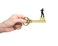 Man balance on treasure key in pound sign shape Royalty Free Stock Photo