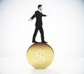 Man balances on a gold coin concept