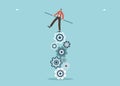 Man balancing on gears