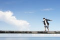 Man balancing on tree trunk high in the sky