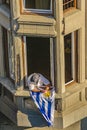 Man at Balcony with Uruguayan Flag