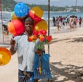 Man with baloons on poson festival Royalty Free Stock Photo