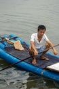 Man on the bamboo boat on Li River in Yangshuo