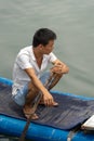 Man on the bamboo boat on Li River in Yangshuo
