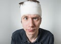 Man with bandage on his head