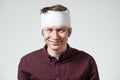 Man with bandage on his head