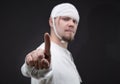 Man with bandaged head showing forefinger Royalty Free Stock Photo