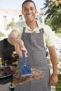 Man Barbequing In A Garden Royalty Free Stock Photo