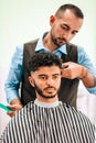 Man at barbershop having haircut Royalty Free Stock Photo