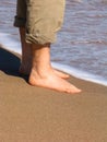 Man barefood on the beach Royalty Free Stock Photo
