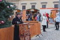 Man with barrel organ at Christmas market on the Cabbage Market on November26, 2023 Brno, Czech Republic