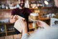 Man or bartender serving customer at coffee shop Royalty Free Stock Photo