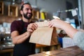 Man or bartender serving customer at coffee shop Royalty Free Stock Photo