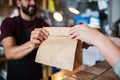 Man or bartender serving customer at coffee shop Royalty Free Stock Photo