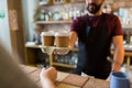 Man or bartender serving customer at coffee shop Royalty Free Stock Photo