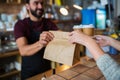 Man or bartender serving customer at coffee shop Royalty Free Stock Photo