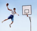 Man, basketball and dunk jump on outdoor court for scoring point, game challenge or athlete. Male person, hand and hoop Royalty Free Stock Photo