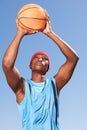 Man, basketball and player for point in blue sky for fitness challenge or sports train game, match as athlete. Black Royalty Free Stock Photo