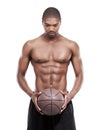 Man, basketball player and shirtless for training, serious and standing on white background, confident and game. Studio Royalty Free Stock Photo