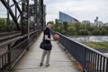 Man With a Basketball Posing Near Railway Tracks Royalty Free Stock Photo