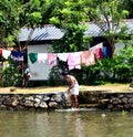 A man bathing in the freshwater of the back waters