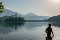 Man bathing in Lake Bled at sunset, in Slovenia Royalty Free Stock Photo