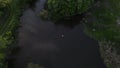 man bathing in the river. aerial drone shooting