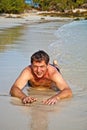 Man in bathingsuit lying at Royalty Free Stock Photo