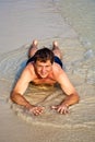 Man in bathingsuit is lying at the beach Royalty Free Stock Photo