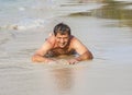Man in bathingsuit is lying at the beach Royalty Free Stock Photo