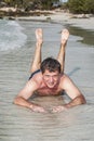 Man in bathingsuit is lying at the beach Royalty Free Stock Photo