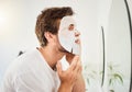 Man, bathroom mirror and skincare face mask beauty cosmetics cleanser for oil problem or hygiene treatment. Young male Royalty Free Stock Photo