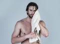 Man in bathroom with muscular body on grey background. Morning washing, wake up, everyday life. Hygiene, sexy guy wash Royalty Free Stock Photo