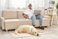 A man, battling myasthenia gravis, sits