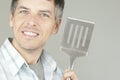 Man With BBQ Flipper Royalty Free Stock Photo